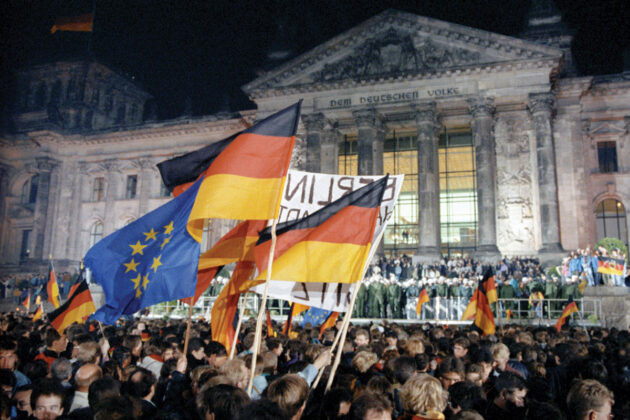 german and EU flags in front of the bundestag