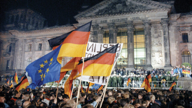 german and EU flags in front of the bundestag