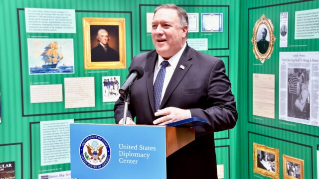 Secretary of State Mike Pompeo speaking in front of the exhibit