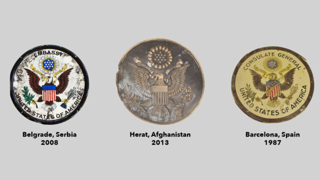 Three State Department seals on a gray background