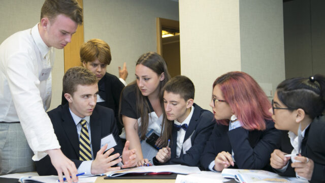 A group of students taking part in a diplomacy simulation