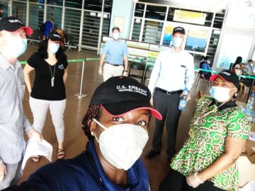 Staff from the U.S. Embassy in Yaoundé, Cameroon supporting repatriation efforts pose outside the airport in their protective masks. Photo courtesy of U.S. Embassy Yaoundé, Cameroon