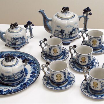 Porcelain tea set featuring Secretary Albright and her team.