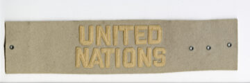 An armband with United Nations in felt