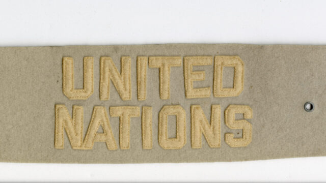 An armband with United Nations in felt