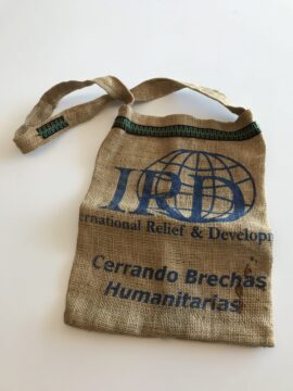 A burlap sack with an IRD logo