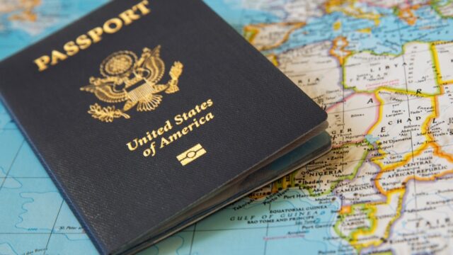US passport on a background of a world map
